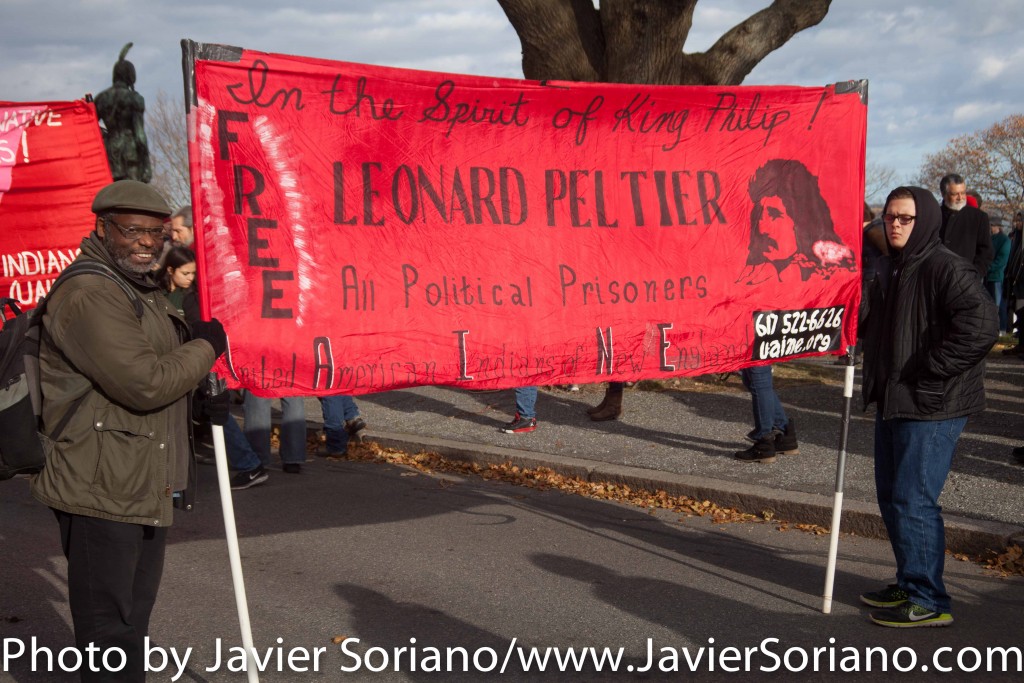 On Thursday, November 26, 2015, hundreds of Indigenous people and allies gathered at Cole’s Hill in Plymouth, Massachusetts to honor Native ancestors. According to the United American Indians of New England, “it is a day of remembrance and spiritual connection.” The 46th National Day of Mourning was dedicated to Native American political prisoner, Leonard Peltier. Photo by Javier Soriano/http://www.JavierSoriano.com/