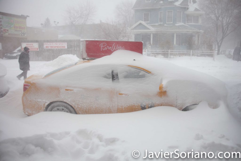 1/23/2016 New York City - It's snowing in NYC. I love snow. Taxi, taxi, I need you to take me to a Jamaican restaurant. Are not you working? OK.... Photo by Javier Soriano/www.JavierSoriano.com