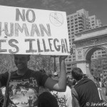"No human is illegal" A protester in Washington Square Park. She marched to Union Square Park. Photo taken by Javier Soriano/www.JavierSoriano.com on 5/1/2014