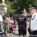 8/2/2016 - NYPD agent and #ShutDownCityHallNYC demonstrators in Abolition Park ( City Hall Park). NYC.
Photo by Javier Soriano/http://www.JavierSoriano.com/