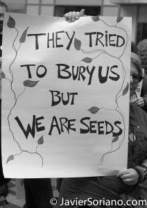 3/25/2017 NYC - People for Free Press. Activist at Bryant Park. "They tried to bury us but we are seeds." Photo by Javier Soriano/www.JavierSoriano.com