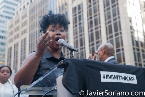 8/23/2017 NYC - Woman singing "Lift Every Voice and Sing," known as the Black National Anthem at the “United We Stand” rally in support of Colin Kaepernick. James Weldon Johnson composed the lyrics of "Lift Ev'ry Voice and Sing." Photo by Javier Soriano/www.JavierSoriano.com
