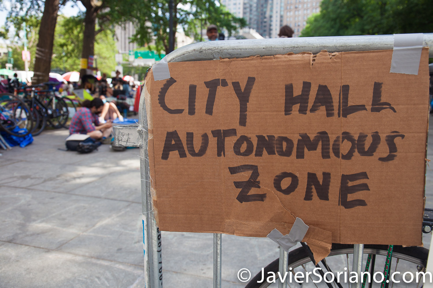 Thursday, June 25, 2020. New York City – “Occupy City Hall” protestors demand NYC Council members, Corey David Johnson, Speaker of the New York City Council and NYC Mayor, Bill de Blasio Defund The NYPD by at least $1 billion and invest in Youth services, affordable housing, healthcare, public education, social workers, and other social services in low income communities. Activists say they are not leaving City Hall Park until at least $1 billion is cut from the NYPD’s $6 billion annual budget. "Occupy City Hall" or  “City Hall Autonomous Zone”? Did they change the name?  Photo by Javier Soriano/www.JavierSoriano.com