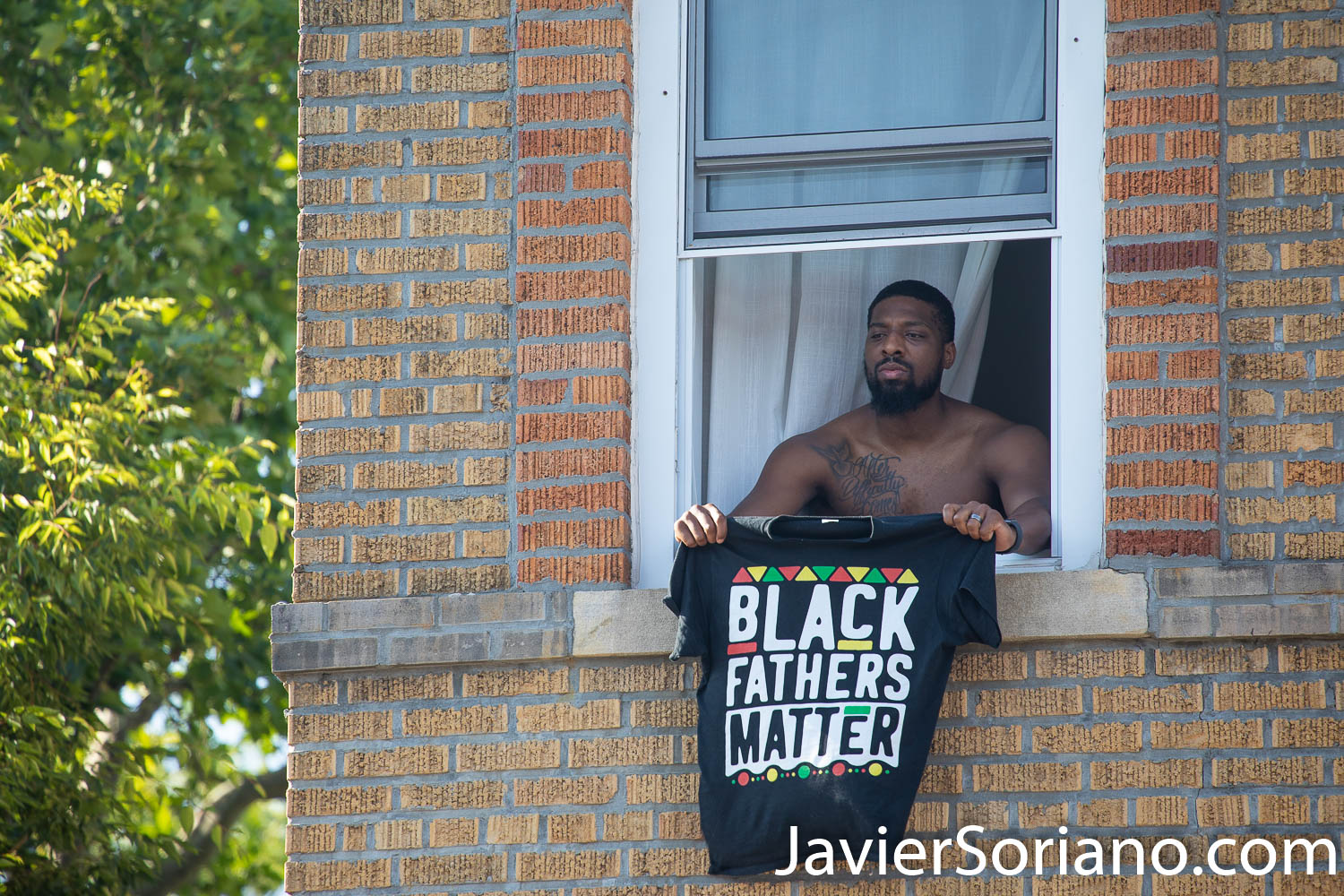 Sunday, June 21, 2020. New York City – “Father’s Day. Faith Leaders Prayer and March” in East Flatbush, Brooklyn. Protestors said they were praying for peace and justice. They marched “in solidarity and support of the fight of systemic racism.” People marched from Nostrand Avenue and Church Avenue to The Rugby Deliverance Tabernacle on 4901 Snyder ave. This Black man was supporting the march. The t-shirt says, "Black Fathers Matter".  Photo by Javier Soriano/www.JavierSoriano.com