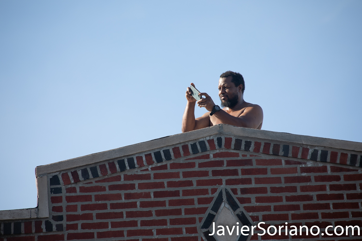 Sunday, June 21, 2020. New York City – “Father’s Day. Faith Leaders Prayer and March” in East Flatbush, Brooklyn. Protestors said they were praying for peace and justice. They marched “in solidarity and support of the fight of systemic racism.” People marched from Nostrand Avenue and Church Avenue to The Rugby Deliverance Tabernacle on 4901 Snyder ave. A Black man filming the march with his cellphone. Photo by Javier Soriano/www.JavierSoriano.com