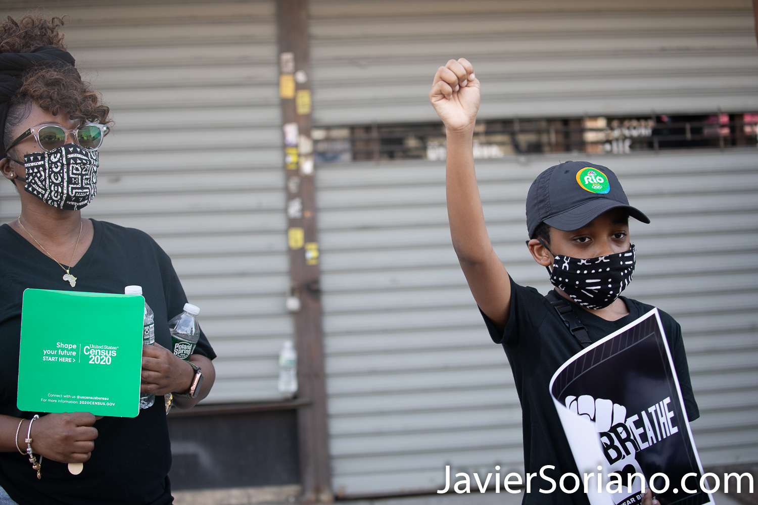 Sunday, June 21, 2020. New York City – “Father’s Day. Faith Leaders Prayer and March” in East Flatbush, Brooklyn. Protestors said they were praying for peace and justice. They marched “in solidarity and support of the fight of systemic racism.” People marched from Nostrand Avenue and Church Avenue to The Rugby Deliverance Tabernacle on 4901 Snyder ave. A mother and her son supporting the march.   Photo by Javier Soriano/www.JavierSoriano.com