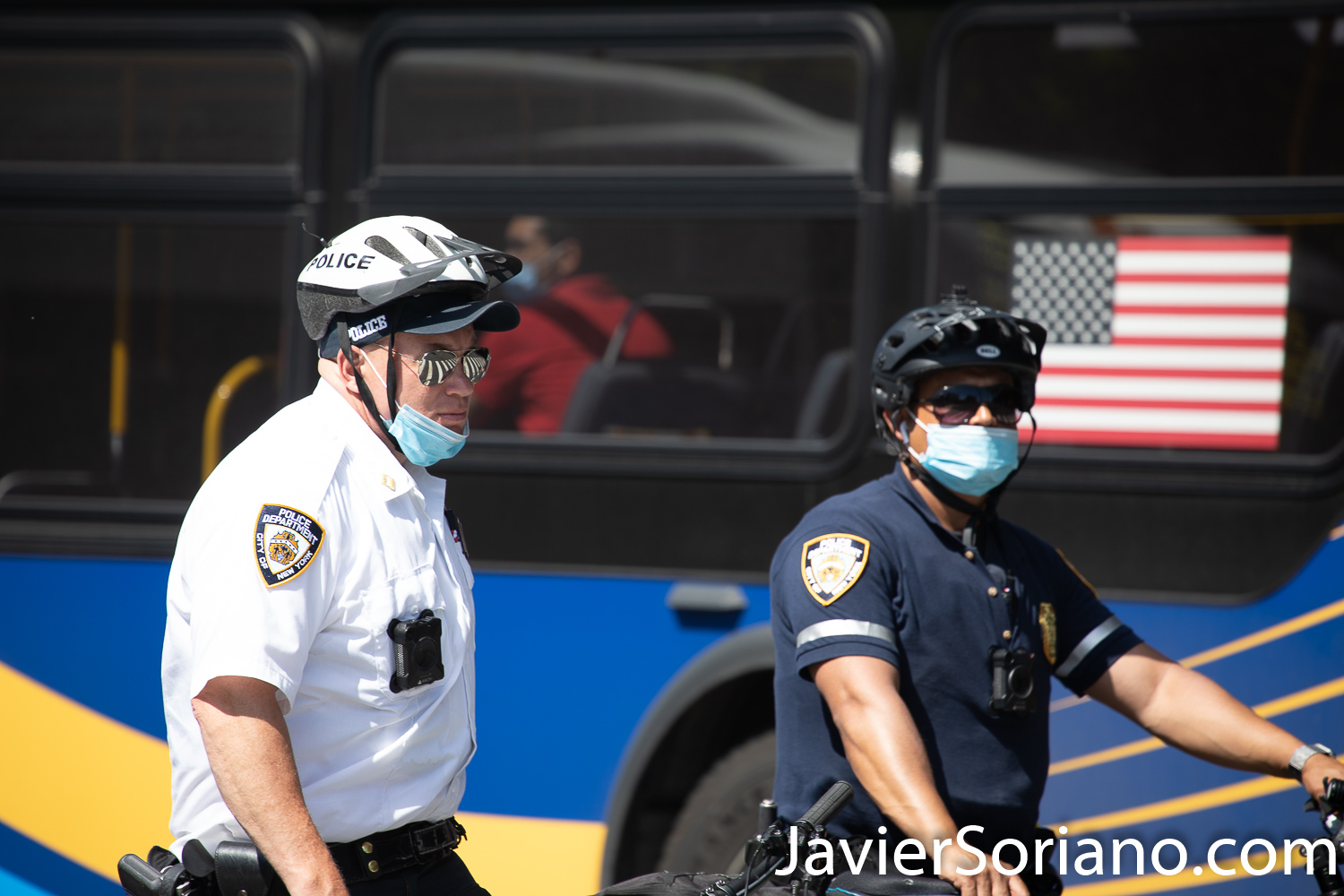 Friday, June 12, 2020. Brooklyn, New York City - Rally and march in Coney Island. Protestors said it was a "Peaceful demonstration for George Floyd, Breonna Taylor and the many other victims of police brutality."  One NYPD officer is not wearing a mask. Another officers is wearing the mask incorrectly.  Protestors want NYPD officers to wear a mask.   Photo by Javier Soriano/www.JavierSoriano.com