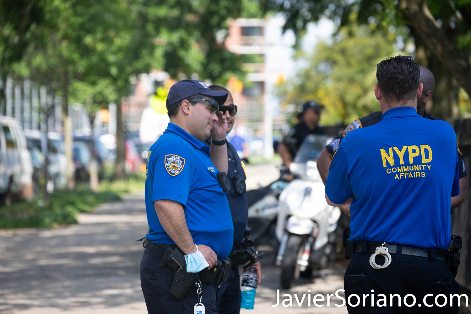Friday, June 12, 2020. Brooklyn, New York City - Rally and march in Coney Island. Protestors said it was a "Peaceful demonstration for George Floyd, Breonna Taylor and the many other victims of police brutality." These four NYPD officers are not wearing a mask. Protestors want NYPD officers to wear a mask. Photo by Javier Soriano/www.JavierSoriano.com