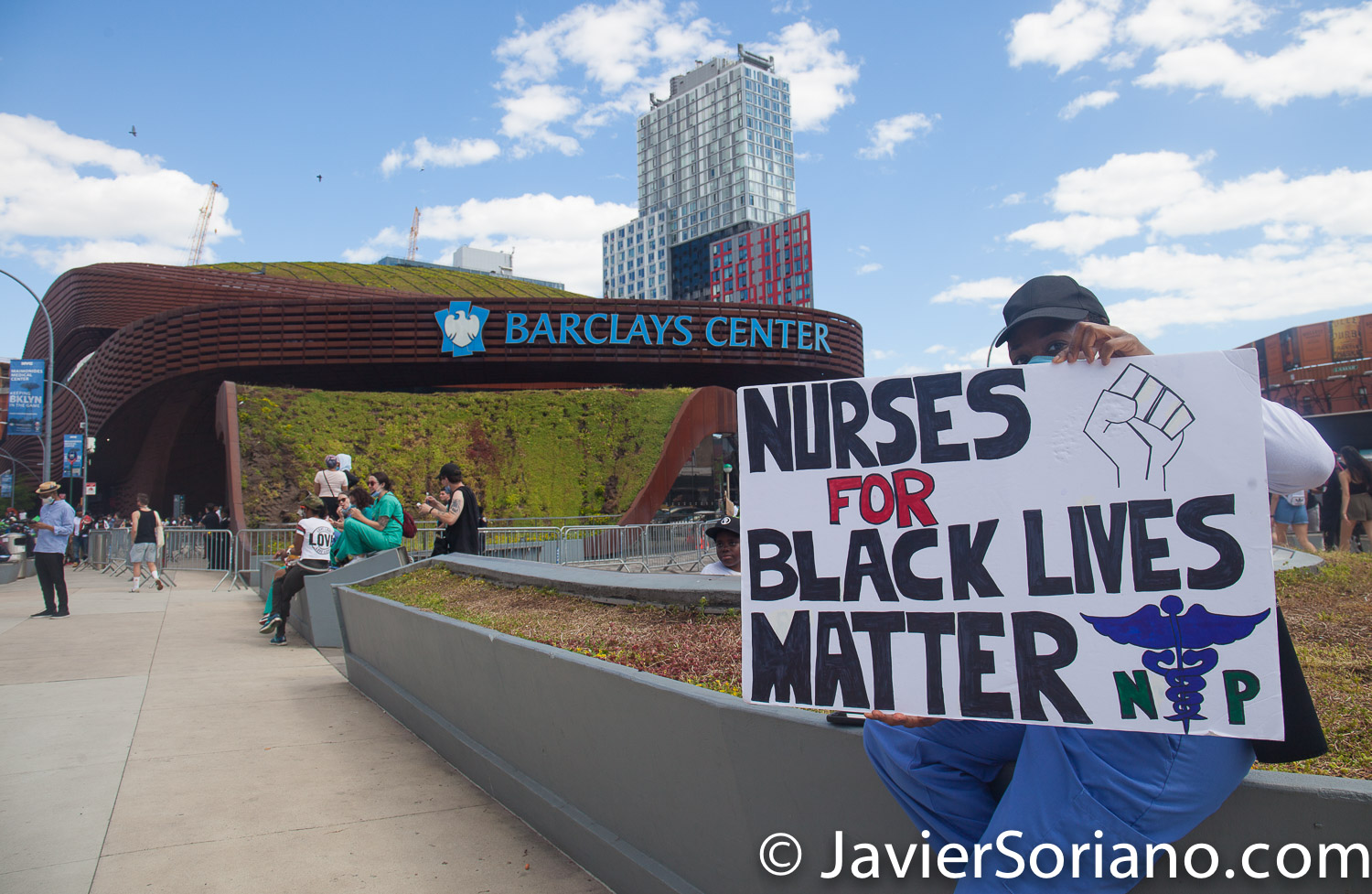 Sunday, June 7, 2020. Brooklyn, New York City - A nurse in front of the Barclays Center.  The sign says, "Nurses for Black Lives Matter".  Photo by Javier Soriano/www.JavierSoriano.com