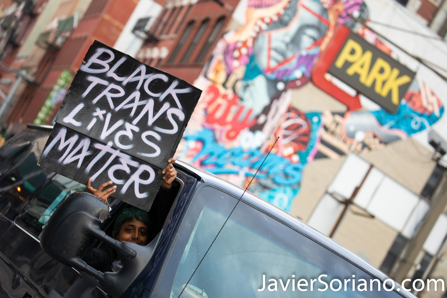 Tuesday, June 2, 2020. New York City - March from The Stonewall Inn to the Lower Manhattan to demand justice for George Floyd, Breonna Taylor, and too many others victims of police violence in the United States of America. A person observing the march. The sign says, "Black Trans Lives Matter". Photo by Javier Soriano/www.JavierSoriano.com