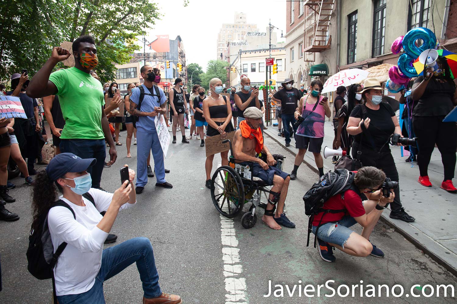 Thursday, July 30, 2020. Manhattan, New York City - Rally and March: “Liberation for Black Queer and Trans people.”  Protesters had a rally in front of The Stonewall Inn. After the rally, they marched to Foley Square Park.  A Trans woman  said sometimes Trans women and Trans men are killed by police and sometimes they are killed by their own community. Activists said all Black Lives Matter.  Joel rivera said, the rally and march was to honor and acknowledge Black Queer and Trans people.  The male protester on the wheelchair harassed a female photographer, a male photographer and me. Three women asked him to stop.  Photo by Javier Soriano/www.JavierSoriano.com