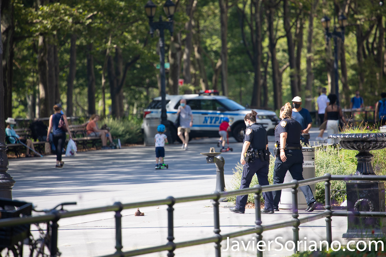 Saturday, July 18, 2020. Brooklyn, New York City – “The Vile identities of Christopher Columbus: A Teach-In.” This event was in Columbus Park. Downtown Brooklyn, New York City. Organizers say, “We are community members who are demanding that all statues of Columbus are taken down by October 12th, 2020. Columbus represents the oppression and violence of colonialism." Police officers watching protesters. Photo by Javier Soriano/www.JavierSoriano.com