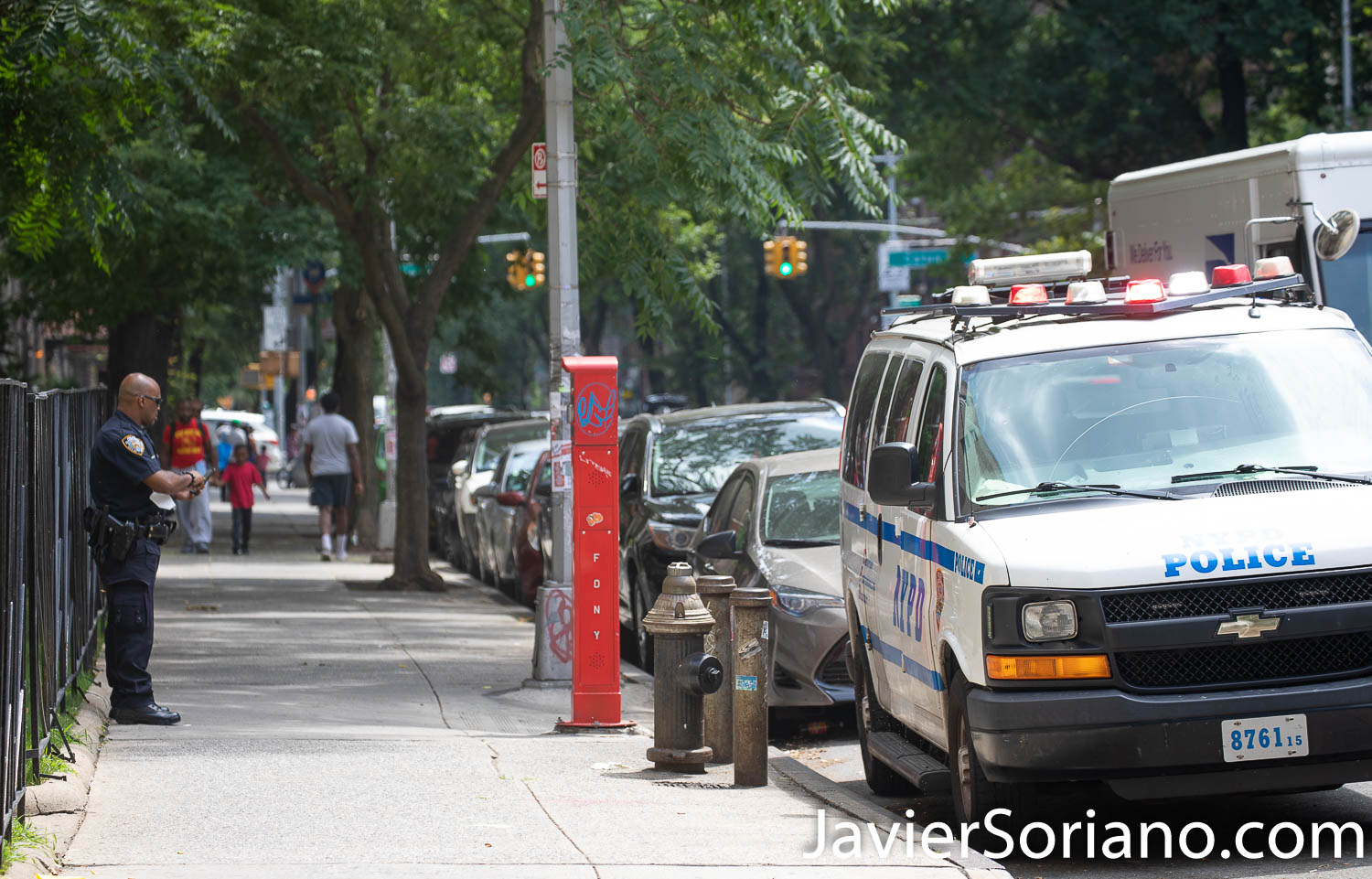 Saturday, August 15, 2020. Brooklyn, New York City - On Friday, August 14, 2020, Deshawn Reid was shot and killed just steps from his building on Ocean Ave. near Crooke Ave. in Flatbush. The NYPD officer is standing in the area where Reid was shot. Photo by Javier Soriano/www.JavierSoriano.com