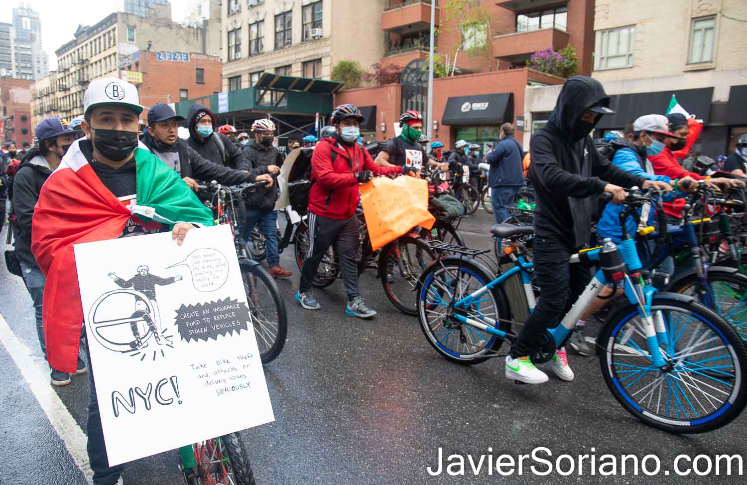 Wednesday, April 21, 2021. Manhattan, New York City - Thousands of food delivery workers (essential workers) marched from Times Square to Foley Square in Manhattan. Deliveristas demand justice for Francisco Villalva Vitinio. Francisco was an essential worker man. He was shot and killed on Monday, March 29, 2021, in East Harlem, Manhattan. In addition, they demand justice, protections and better working conditions. The sign of this essential worker says: "You aren't just stealing my bike, you're stealing my ability to work. Create an insurance fund to replace stolen vehicles. NYC, take bike theft and attacks on delivery workers SERIOUSLY." Photo by Javier Soriano/www.JavierSoriano.com