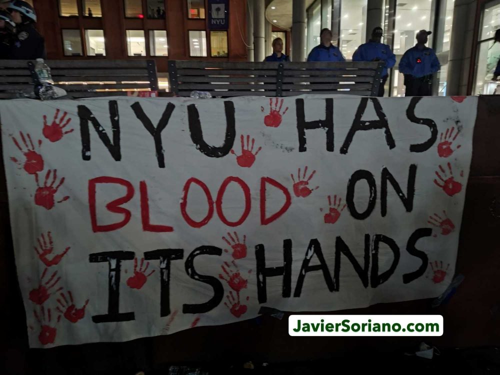 Monday, April 22, 2024. Manhattan, New York City - On April 22, 2024, students and faculty began the first “Gaza Solidarity Encampment” at New York University (NYU), demanding NYU to divest from companies with ties to the zionist, apartheid, terrorist entity. There were hundreds of peaceful protesters inside and outside the encampment. THIS PHOTO: On the same day, after NYPD officers arrested at least 130 peaceful New Yorkers, a banner with the message: “NYU has blood on its hands.” Photo by Javier Soriano/www.JavierSoriano.com.