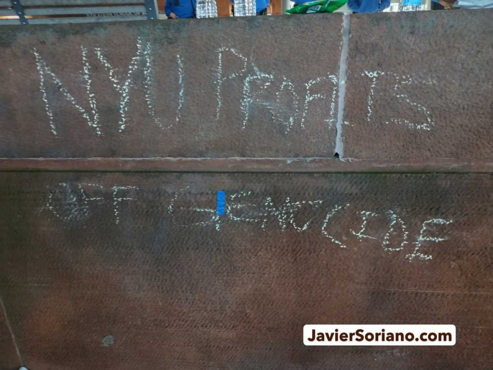 Monday, April 22, 2024. Manhattan, New York City - On April 22, 2024, students and faculty began the first “Gaza Solidarity Encampment” at New York University (NYU), demanding NYU to divest from companies with ties to the zionist, apartheid, terrorist entity. There were hundreds of peaceful protesters inside and outside the encampment. THIS PHOTO: On the same day, NYPD officers arrested at least 130 peaceful New Yorkers. Someone wrote the message on a wall: “NYU profits off genocide.” Photo by Javier Soriano/www.JavierSoriano.com.