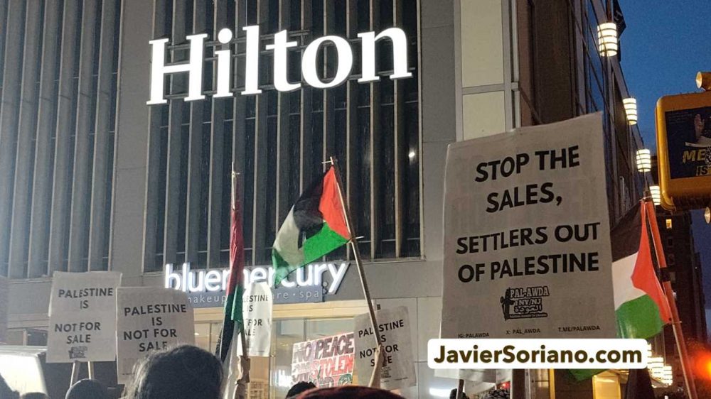 Thursday, May 28, 2026. Occupied Lenapehoking (New York City) – The protest “STOP THE SALE OF STOLEN PALESTINIAN LAND” outside the Hilton Midtown in Manhattan, was organized by PAL-Awda NY/NJ, on May 28, 2026. There were hundreds of Palestinians, anti-zionist Jews and other pro-Palestine, anti-genocide New Yorkers protesting against the sale of stolen land in Palestine and the settler recruitment event inside the Hilton hotel. Photo by Javier Soriano/www.JavierSoriano.com.